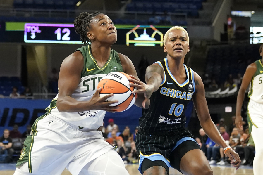 Seattle Storm's Jewell Loyd (24) drives to the basket as Chicago Sky's Courtney Williams defends during the first half of a WNBA basketball game Friday, July 28, 2023, in Chicago.