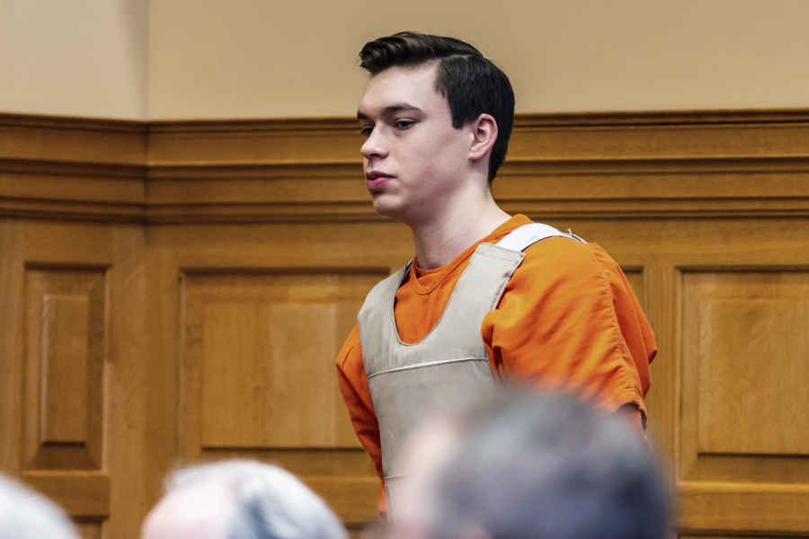 FILE - Willard Miller is led into a courtroom, March 29, 2023, in Fairfield, Iowa, for a hearing related to the murder charge he faces in the 2021 death of Fairfield, Iowa, Spanish teacher Nohema Graber. Miller is one of two Iowa teenagers charged in the beating death of Graber. On Thursday, July 6, Miller will be the first sentenced after he pleaded guilty as part of an agreement in which prosecutors recommended a term of between 30 years and life in prison, with the possibility of parole.