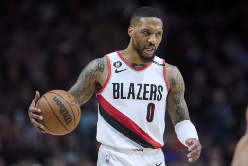 FILE - Portland Trail Blazers guard Damian Lillard brings the ball up against the New York Knicks during the second half of an NBA basketball game in Portland, Ore., Tuesday, March 14, 2023. (AP Photo/Craig Mitchelldyer, File)