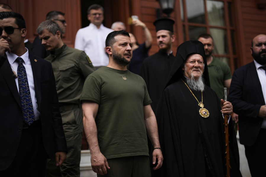 Ukrainian President Volodymyr Zelenskyy, center left, stands next to Ecumenical Patriarch Bartholomew I, the spiritual leader of the world's Orthodox Christians, at the Patriarchal Church of St. George in Istanbul, Turkey, Saturday, July 8, 2023. Zelenskyy attended a memorial ceremony for the victims of the war in Ukraine led by Patriarch Bartholomew I.