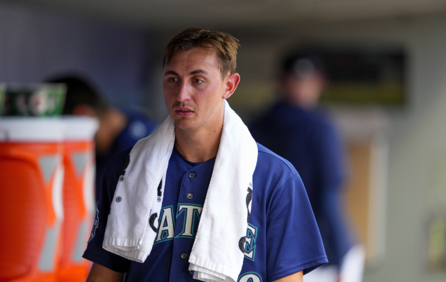Seattle Mariners starting pitcher George Kirby walks in the dugout after pitching through seven innings of a baseball game against the Minnesota Twins, Thursday, July 20, 2023, in Seattle.