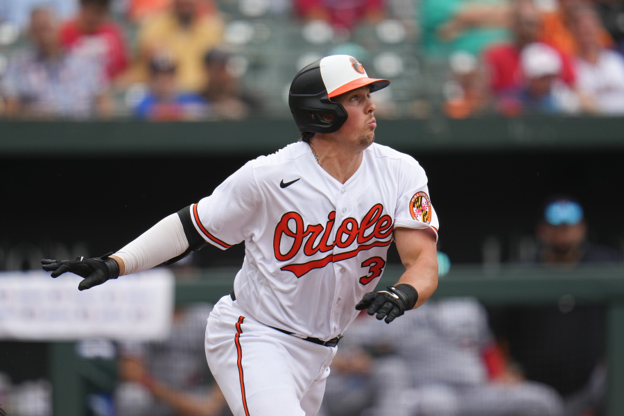 Baltimore Orioles' Adley Rutschman runs out of the box while hitting an infield single against the Minnesota Twins in the eighth inning of a baseball game, Sunday, July 2, 2023, in Baltimore. The Orioles won 2-1.