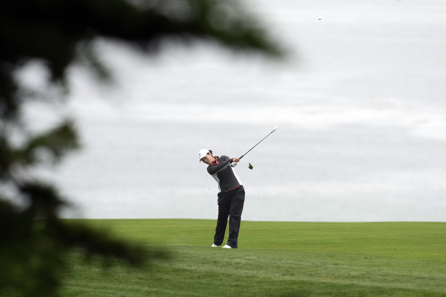 Xiyu Janet Lin, of China, hits from the fairway on the 11th hole during the first round of the U.S. Women's Open golf tournament at the Pebble Beach Golf Links, Thursday, July 6, 2023, in Pebble Beach, Calif. (AP Photo/Godofredo A.