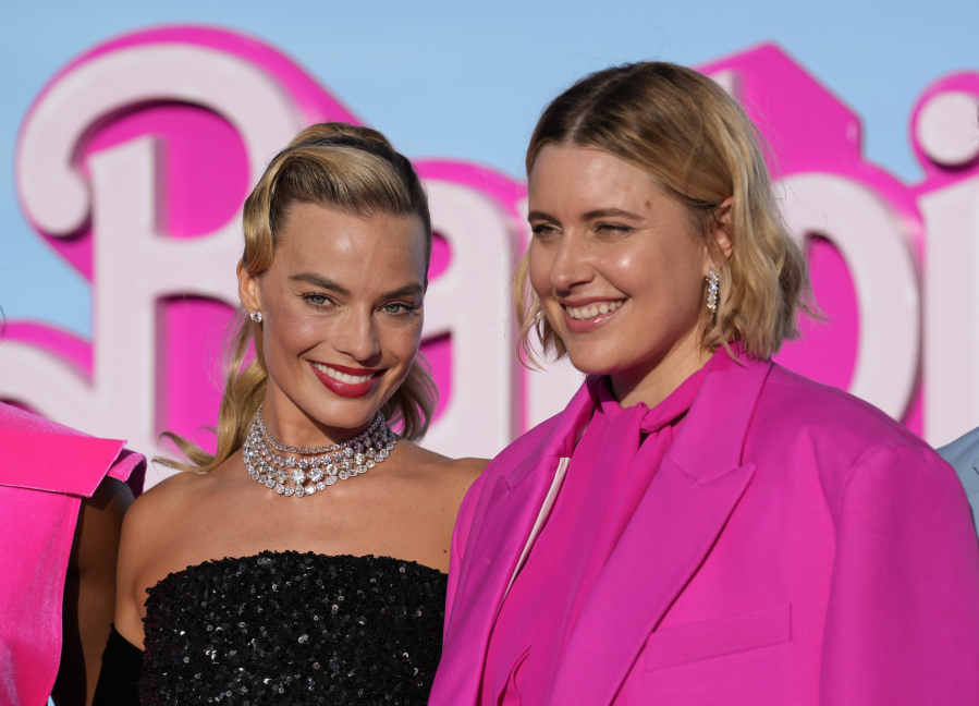 Margot Robbie, left, and writer/director/executive producer Greta Gerwig arrive at the premiere of "Barbie" on Sunday, July 9, 2023, at The Shrine Auditorium in Los Angeles.