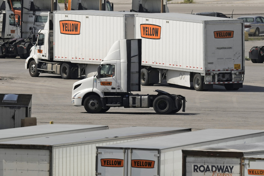 FILE - Yellow Corp. trucks navigate the YRC Freight terminal Friday, July 28, 2023, in Kansas City, Mo. Trucking company Yellow Corp. has shut down operations and is headed for a bankruptcy filing, Sunday, July 30, 2023, according to the Teamsters Union and multiple media reports. After years of financial struggles, reports of Yellow preparing for bankruptcy emerged last week -- as the Nashville, Tennessee-based trucker saw customers leave in large numbers.