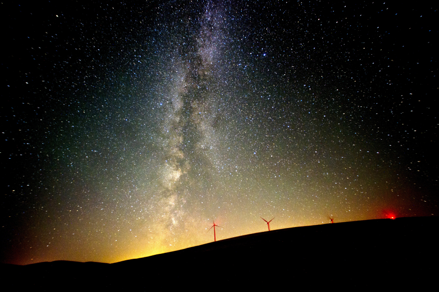The Milky Way lights up the Pacific Northwest sky during the Perseid Meteor Shower Aug. 12, 2016 by the wind mills located north of Dayton, Wash.