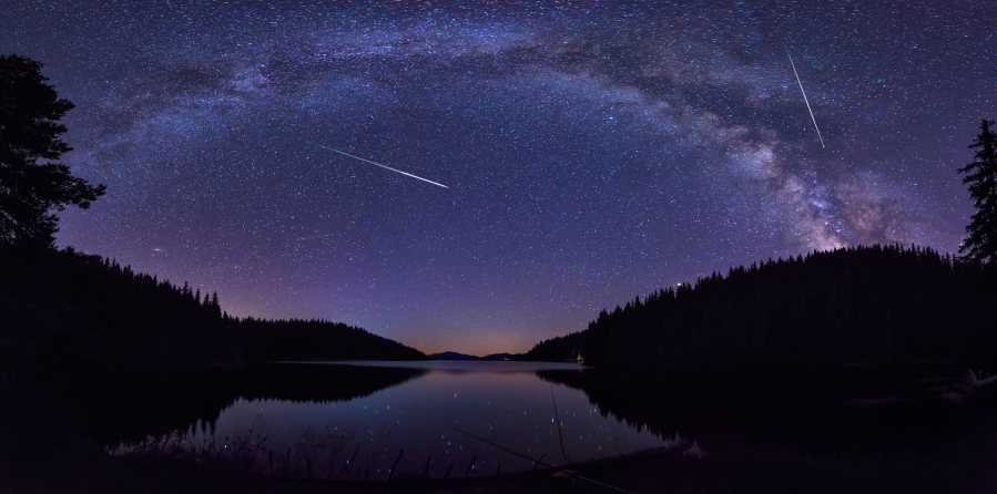 The Perseids in the night sky above the Beglik dam in Rhodopi Mountains, Bulgaria.