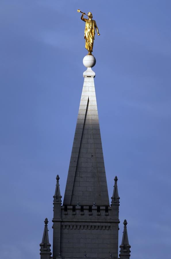 The angel Moroni statue sits atop the Salt Lake Temple, at Temple Square in Salt Lake City. The Church of Jesus Christ of Latter-day Saints' new temple in Moses Lake is open to the public through Aug. 19.