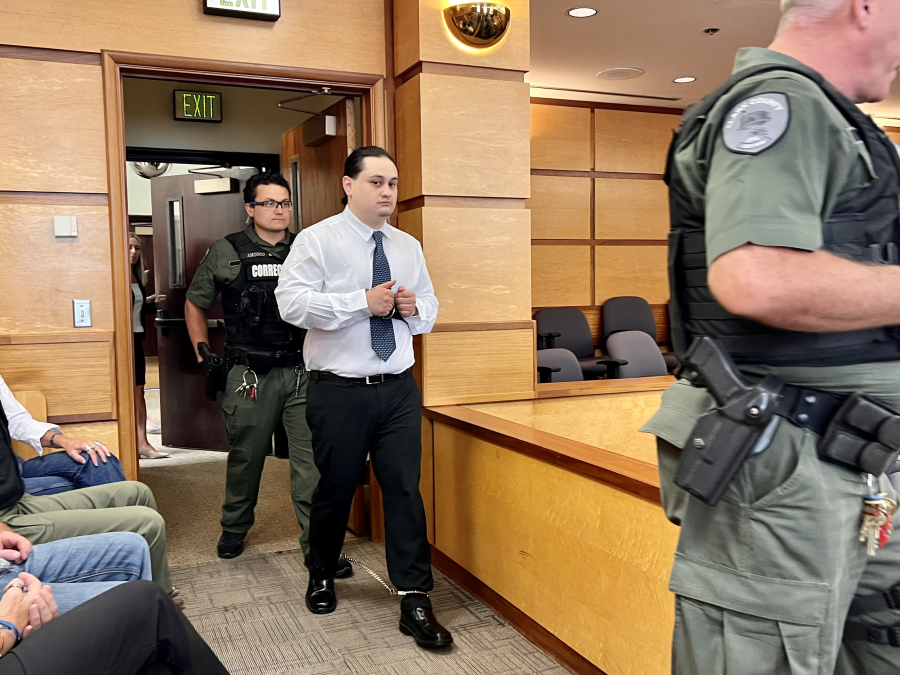 Abran Raya Leon, the getaway driver in the slaying of Clark County sheriff's Sgt. Jeremy Brown, is escorted into the courtroom for the reading of the verdict in his felony murder trial Thursday.