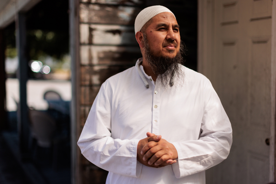 Imam Farid Sulayman stands for a portrait in Seattle's Rainier Valley neighborhood.
