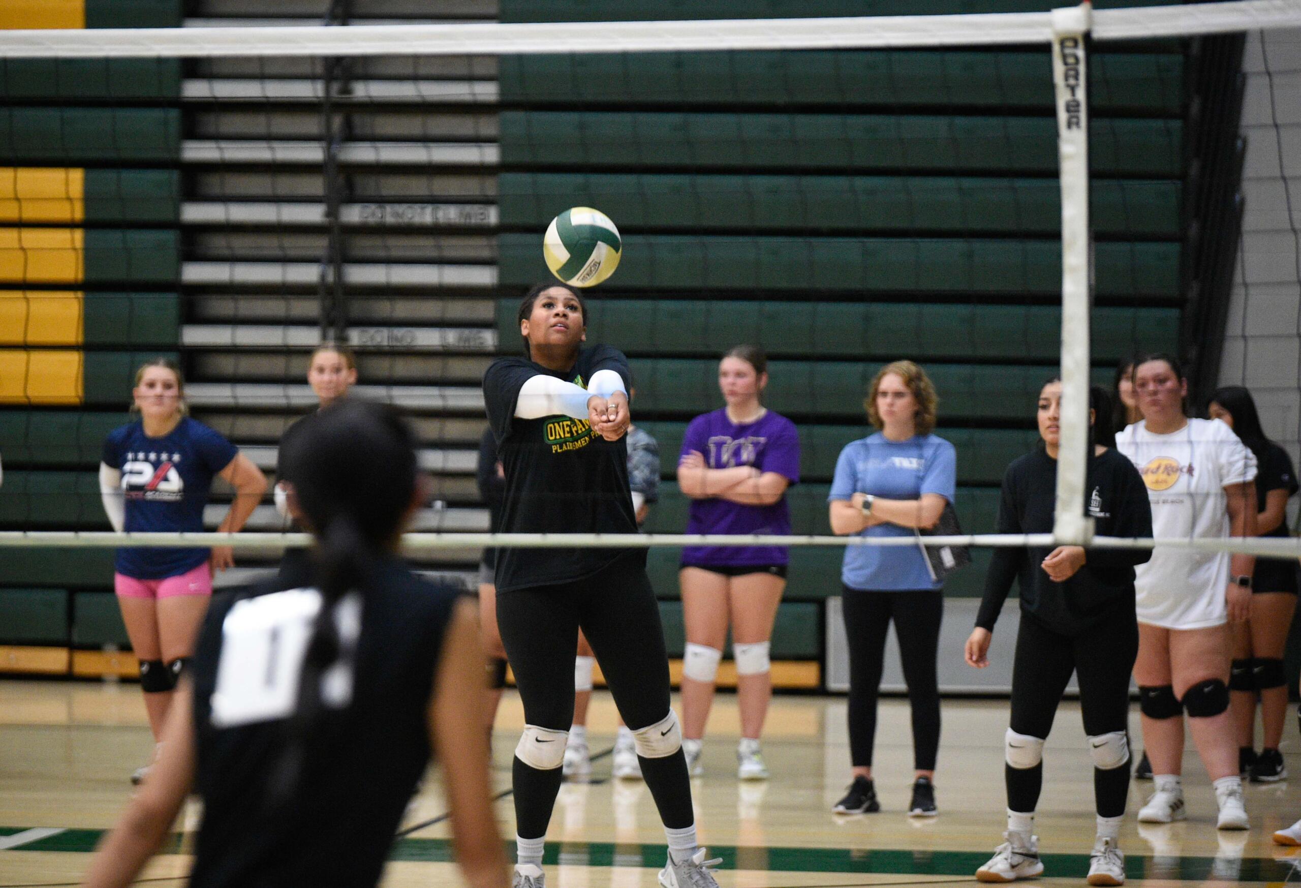 Evergreen volleyball senior Alexis Echols sends the ball over the net during the first day of tryouts on Monday, Aug. 21, 2023, at Evergreen High School.