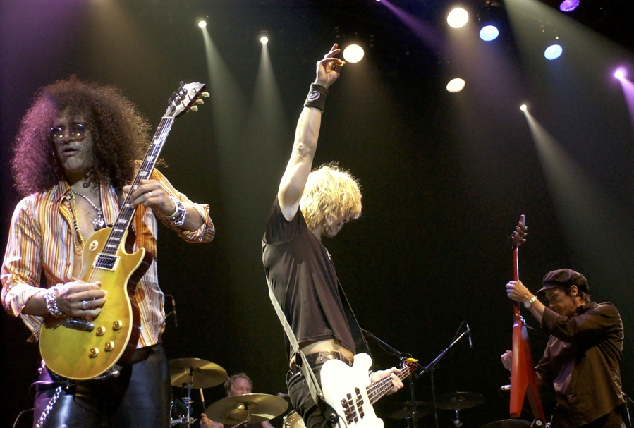 Guns 'N Roses band members perform Nov. 15, 2003, at the Vanity Fair "In Concert" to benefit Step Up Women's Network in Hollywood, Calif.