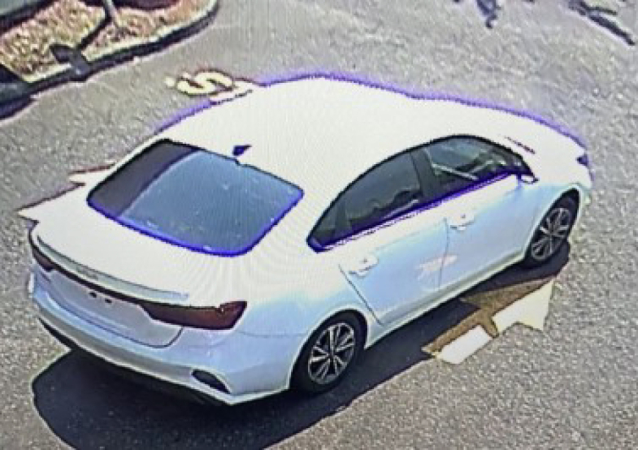 A white Kia sedan Clark County sheriff's deputies say is connected with a Thursday ATM robbery at a Hazel Dell bank. The sheriff's office is asking for the public's help identifying the driver and another man who investigators say grabbed a large amount of cash from the machine.