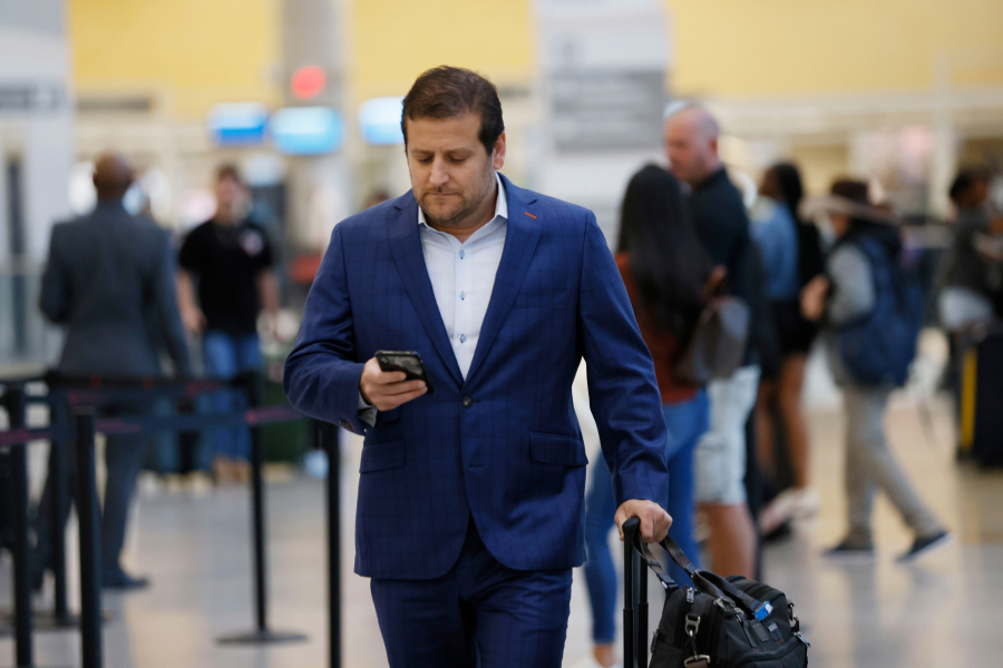 Business traveler Eric Goldmann enters Hartsfield-Jackson Atlanta International Airport on Sept. 21, 2022. The airline industry expects to surpass its prepandemic levels of spending to $1.4 trillion in 2024.