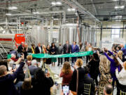 A ribbon is cut during an opening celebration at Peak Drift Brewing in Columbia, South Carolina, on Jan. 18, 2023.