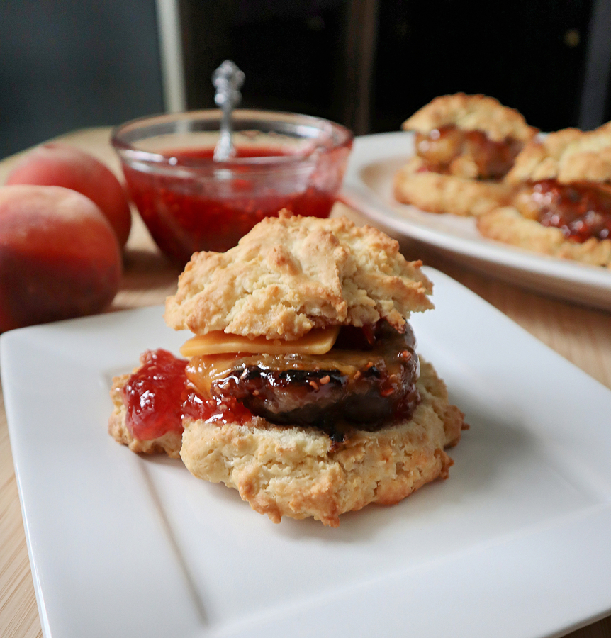 Start the day off right with a homemade sausage biscuit topped with refrigerator raspberry-peach jam.
