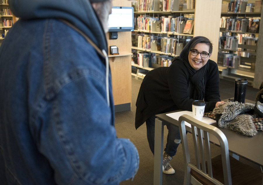 Jamie Spinelli chats in 2018 with a resident at Vancouver Community Library. Spinelli said patience and kindness toward those experiencing homelessness is paramount.