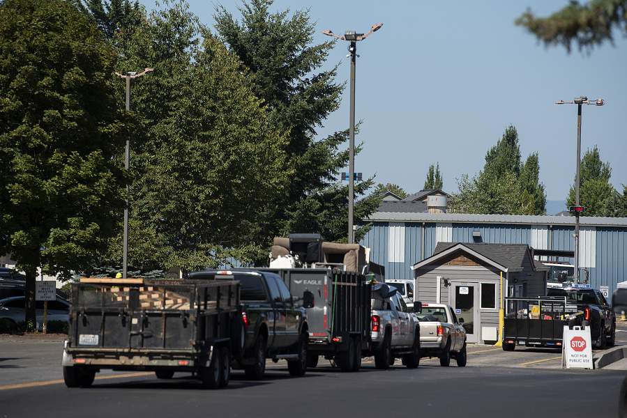Drivers wait in line to unload their garbage and recycling at the Central Transfer and Recycling Center in Vancouver. The Clark County Council is considering purchasing the Central station, as well as the West Vancouver and Washougal transfer stations, before the end of 2027.