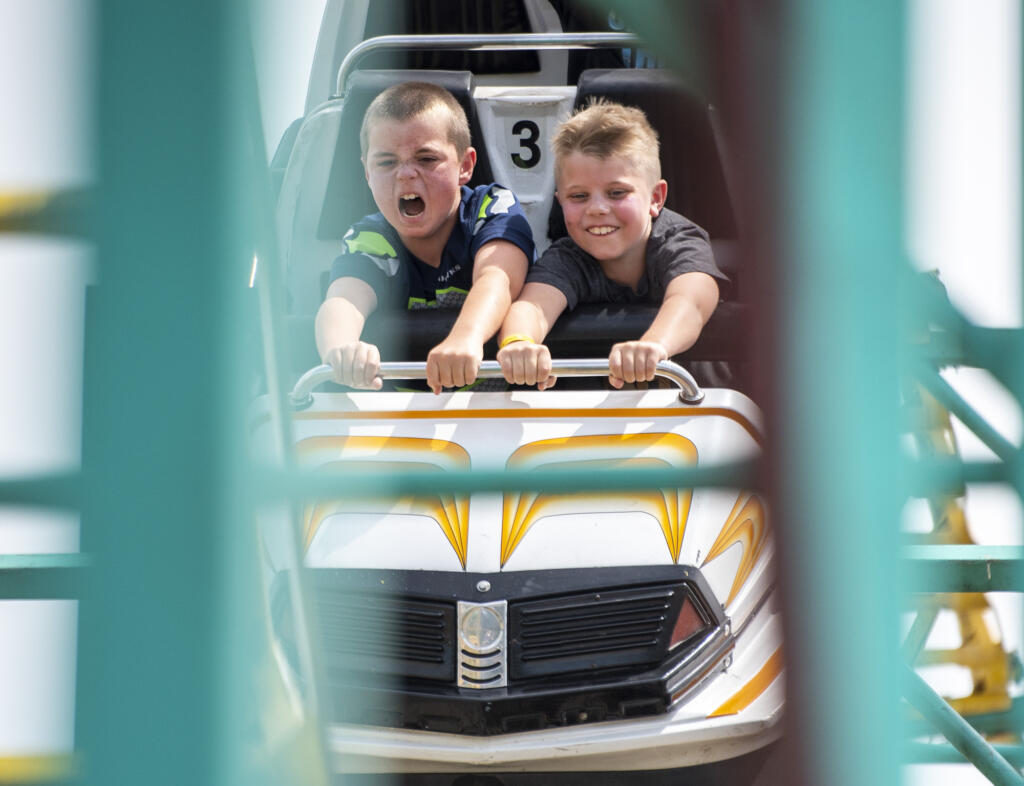Kids ride the Zillerator Coaster ride on Friday, Aug. 4, 2023, at the Clark County Fair.