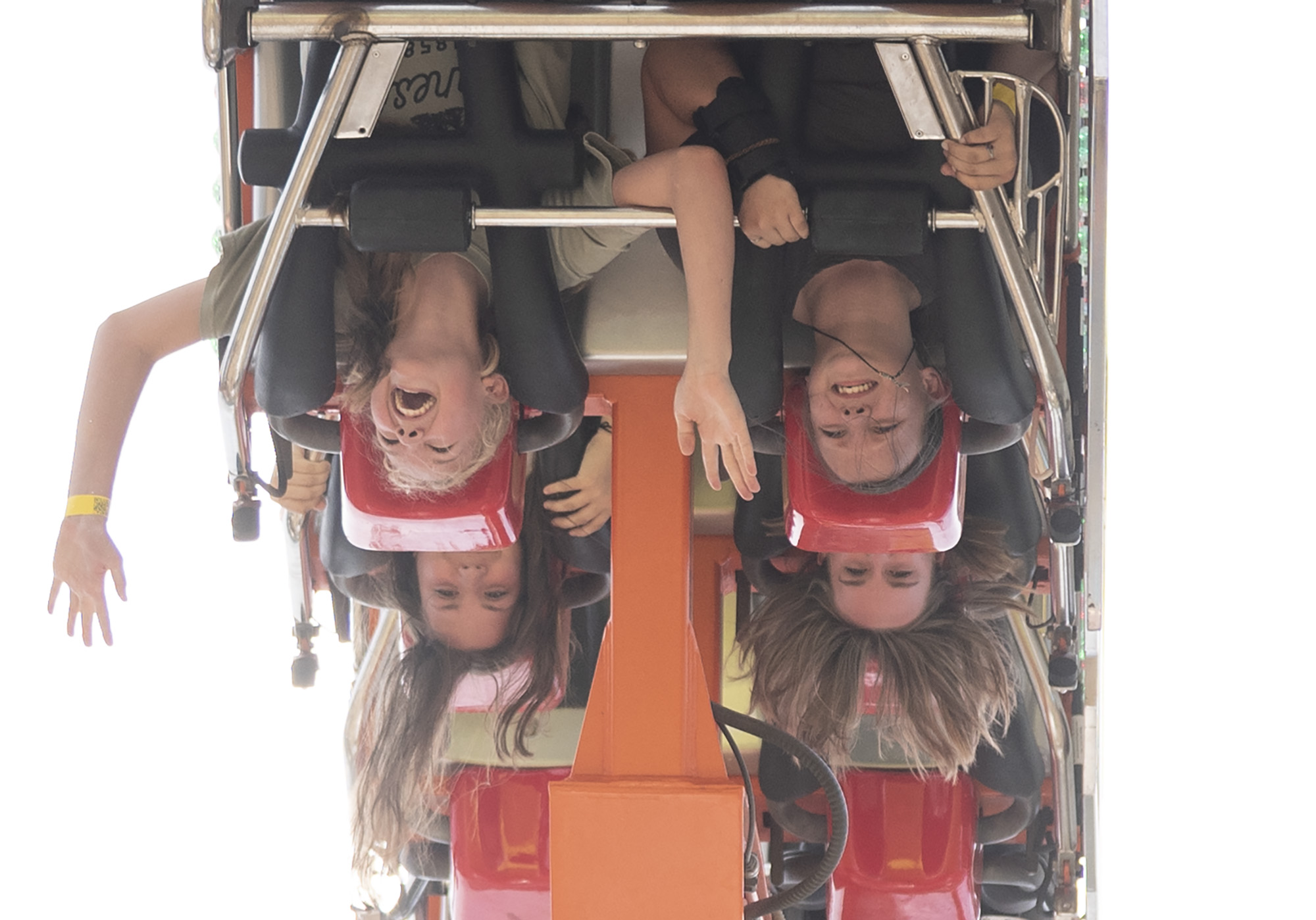 People hang upside down on the Footloose ride Friday, Aug. 4, 2023, at the Clark County Fair.