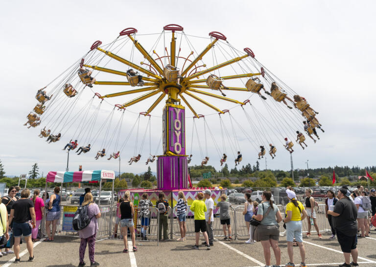People wait in line for the Yoyo ride on Friday, Aug. 4, 2023, at the Clark County Fair.