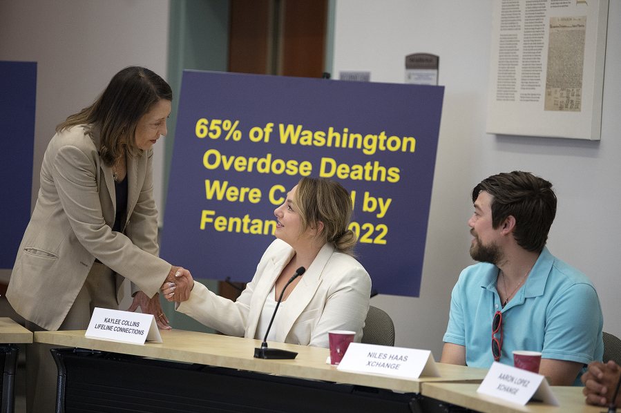 U.S. Sen. Maria Cantwell, from left, greets Kaylee Collins of Lifeline Connections while joined by Niles Haas of the Xchange program before the start of the fentanyl roundtable.