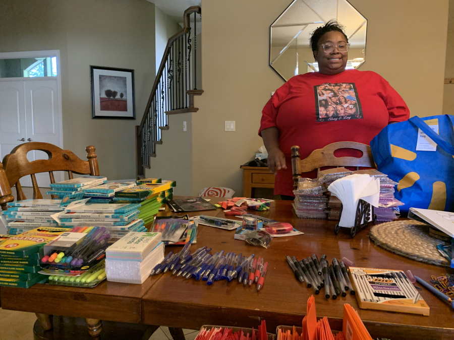 Lequoya Elliott puts school supplies into backpacks to give out to low income families. She started her own nonprofit in November 2020 called Changing Hearts Foundation.