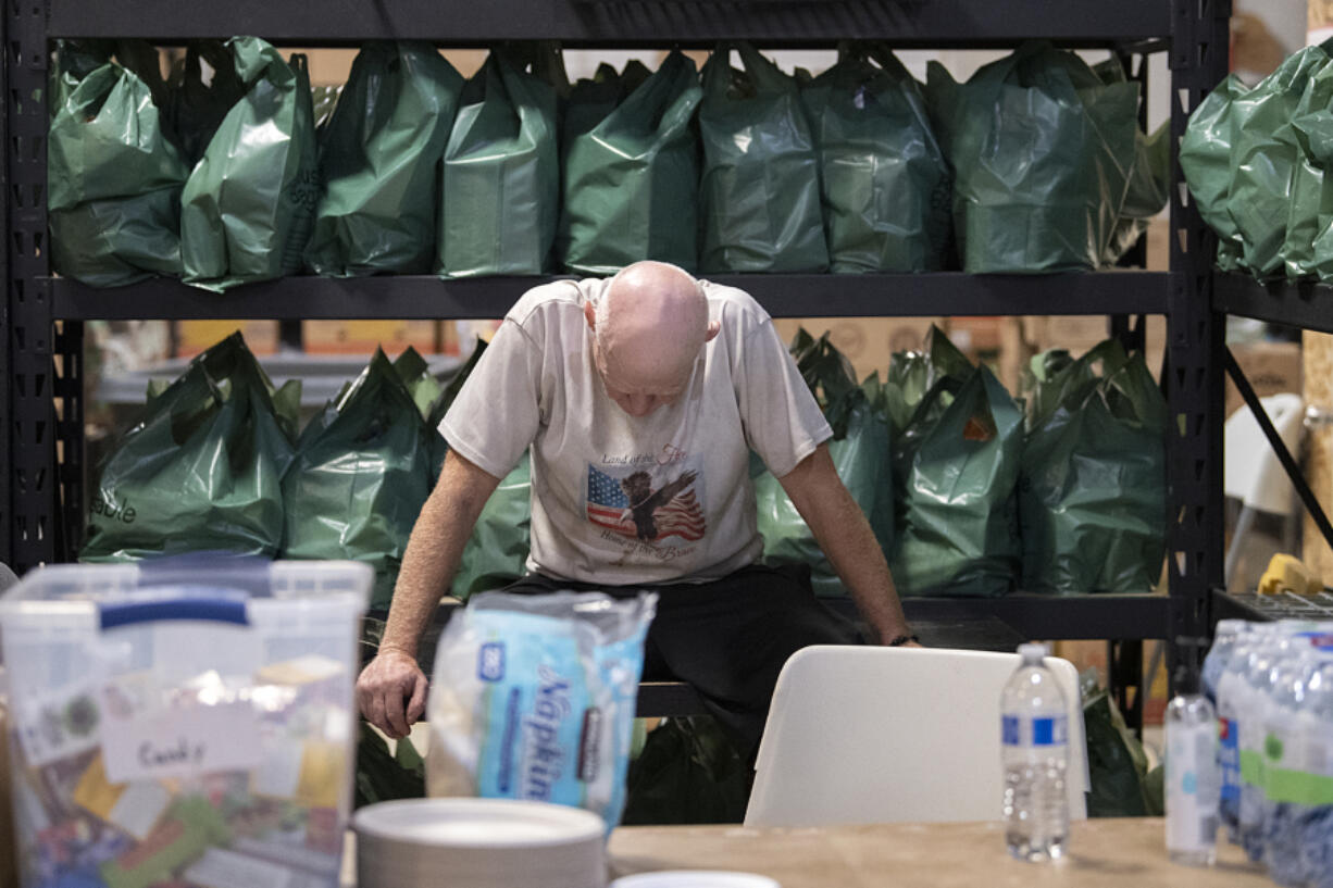 Phillip Dick, who has been a volunteer at Living Hope Church for four years, takes a moment to rest while helping those in need at the church's cooling center. The facility featured air conditioning, water, fresh fruit, snacks and fudge bars for those looking to escape the heat.