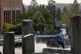 A student strolls through campus on the first day of classes at Washington State University Vancouver on Monday morning.