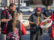 Cowlitz Indian Tribe Drum Group members Jeremiah Wallace, left, and Juan Rodriguez, and others, perform a blessing for the Cowlitz Indian Tribe's new mobile treatment van Friday at the ilani casino.