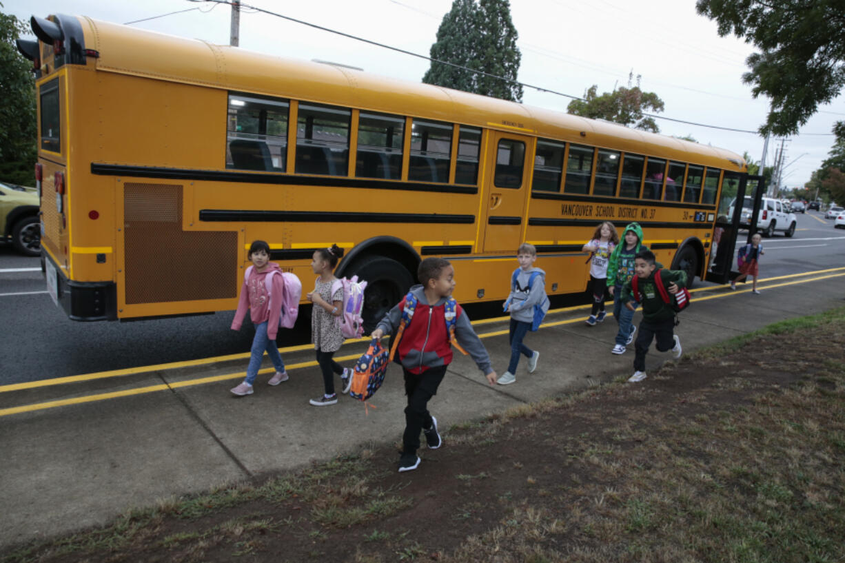 Students arrive Wednesday morning for the first day of school at Harney Elementary in Vancouver.