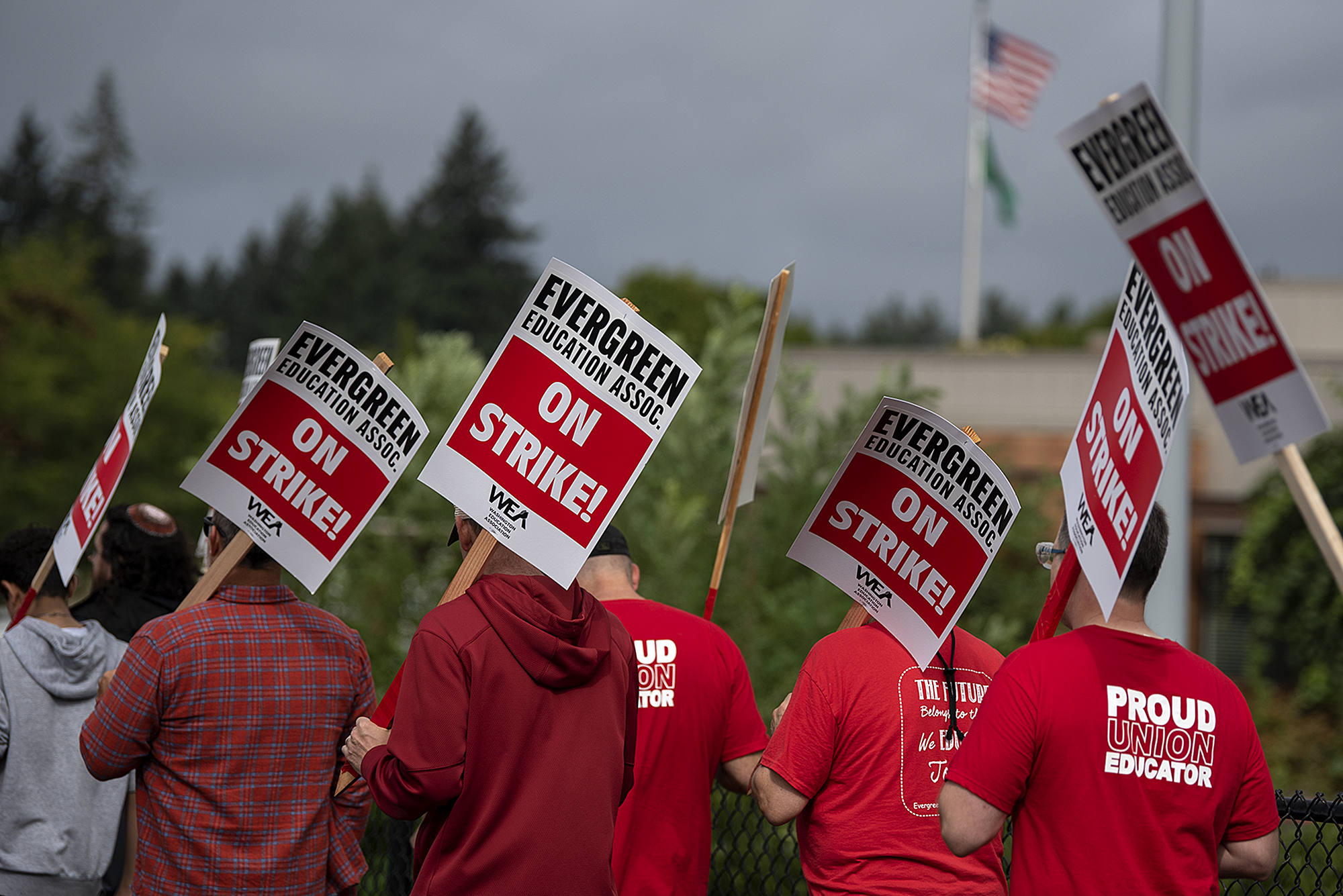 Members of the Evergreen Education Association gather on the picket line outside Evergreen High School on Wednesday morning, Aug. 30, 2023.