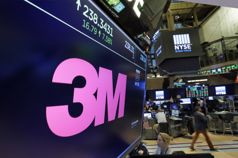 FILE - The logo for 3M appears on a screen above the trading floor of the New York Stock Exchange, Oct. 24, 2017.   3M, on Tuesday, Aug. 29, 2023, has agreed to pay $6 billion to settle numerous lawsuits from U.S. service members who say they experienced hearing loss or other serious injuries from using earplugs made by the company.