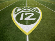 Pac-12 Conference logo on the Autzen Stadium field at Eugene, Ore.