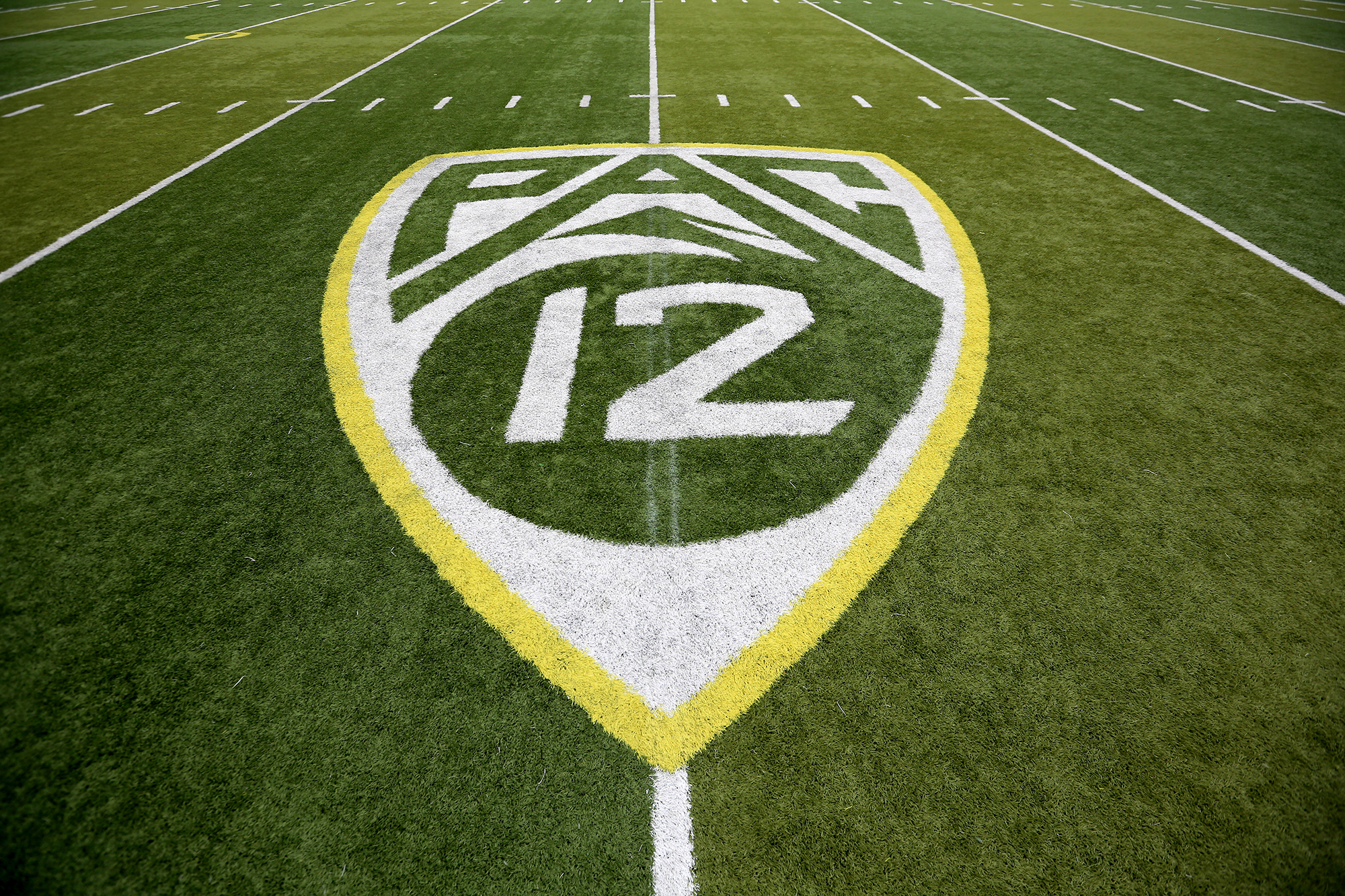 Pac-12 Conference logo on the Autzen Stadium field at Eugene, Ore.