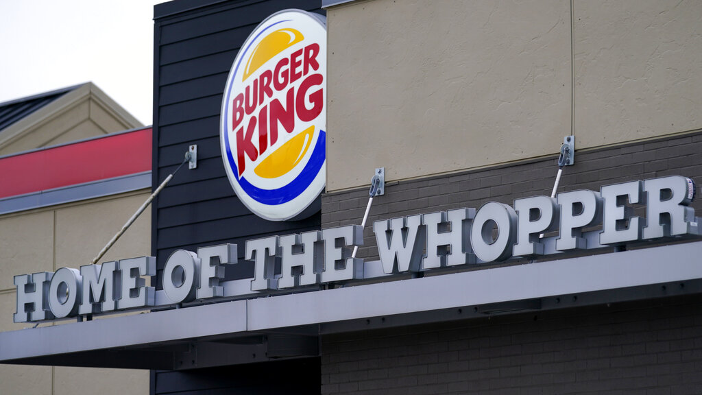 A "Home of the Whopper" sign welcomes customers outside the Burger King fast food restaurant, Monday, Feb. 1, 2021, in Epping, N.H.