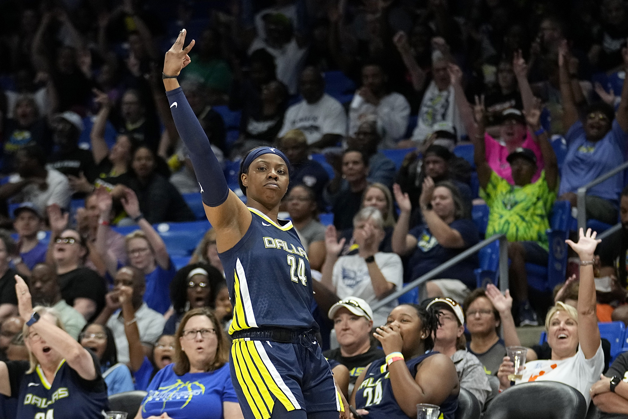 Dallas Wings guard Arike Ogunbowale celebrates after sinking a 3-point basket during the first half of the team's WNBA basketball game against the Washington Mystics, Friday, July 28, 2023, in Arlington, Texas.