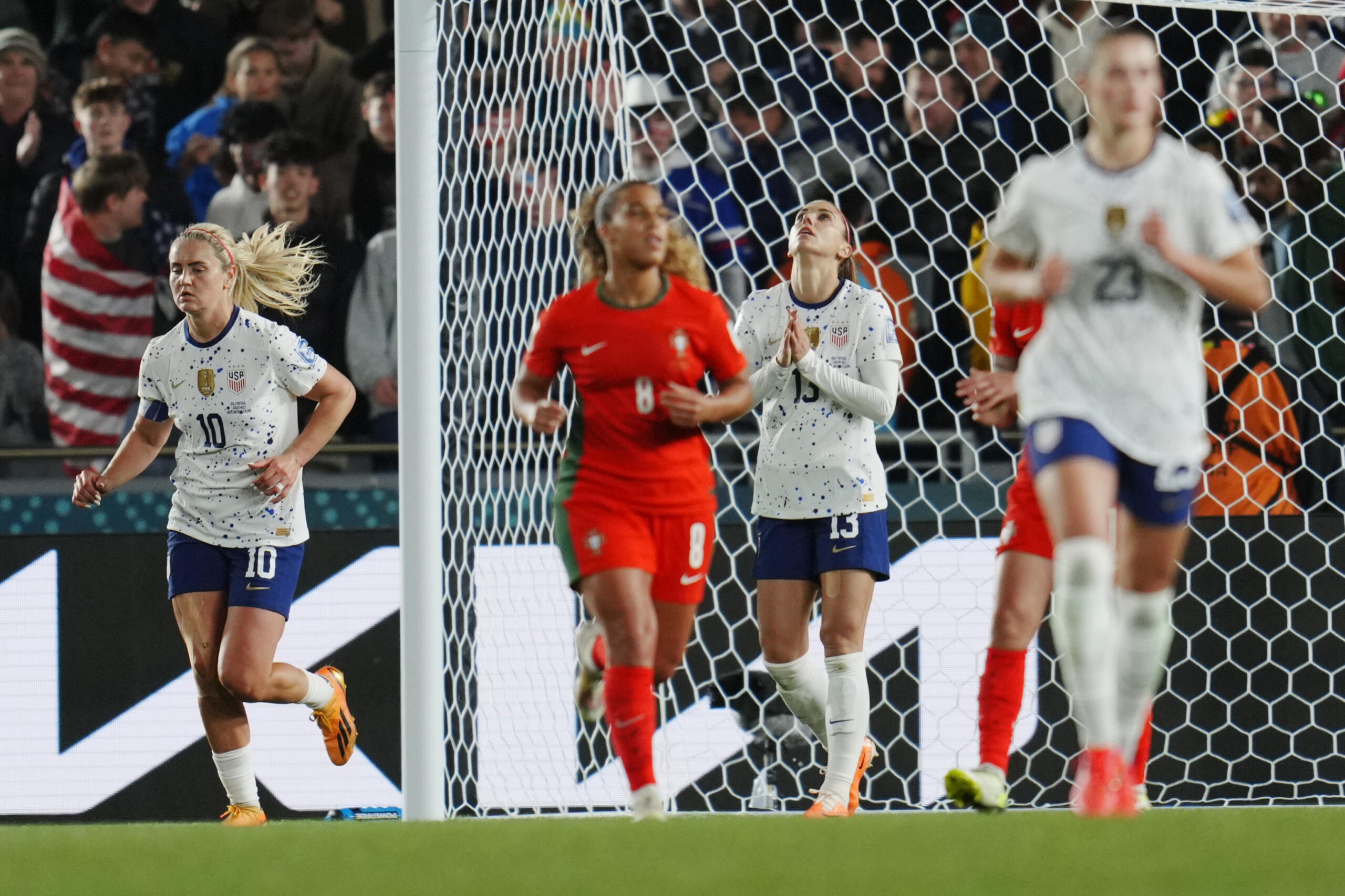United States' Alex Morgan, center, reacts after missing a shot during the second half of the FIFA Women's World Cup Group E soccer match between Portugal and the United States at Eden Park in Auckland, New Zealand, Tuesday, Aug. 1, 2023.