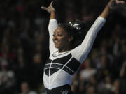 Simone Biles reacts after performing in the floor exercise at the U.S. Classic gymnastics competition Saturday, Aug. 5, 2023, in Hoffman Estates, Ill.