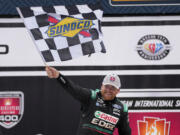 Chris Buescher celebrates his victory during a NASCAR Cup Series auto race at Michigan International Speedway in Brooklyn, Mich., Monday, Aug. 7, 2023.