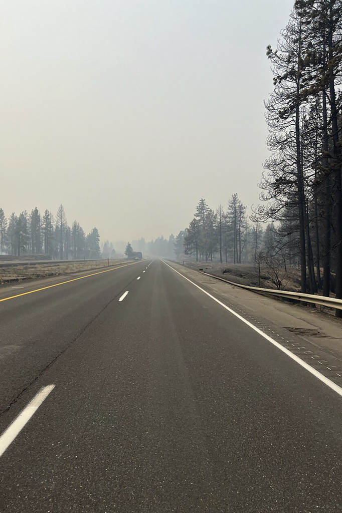 This photo provided by WSDOT East (Washington State of Transportation) smoke from wildfires fill the sky at Salnave/SR 902 interchange in Spokane County, Wash., on Saturday, Aug. 19, 2023.  A fast-moving wildfire in eastern Washington state has destroyed at least 185 structures, closed a major highway and left one person dead. The blaze started on the west side of Medical Lake, a town west of Spokane, at about 12:30 p.m. Friday.