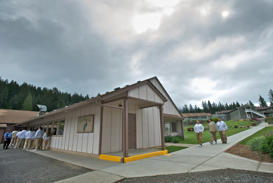 Incarcerated people at Larch Corrections Center line up outside the prison's mess hall to watch an Asian Pacific Islander event put on by fellow inmates in 2013.