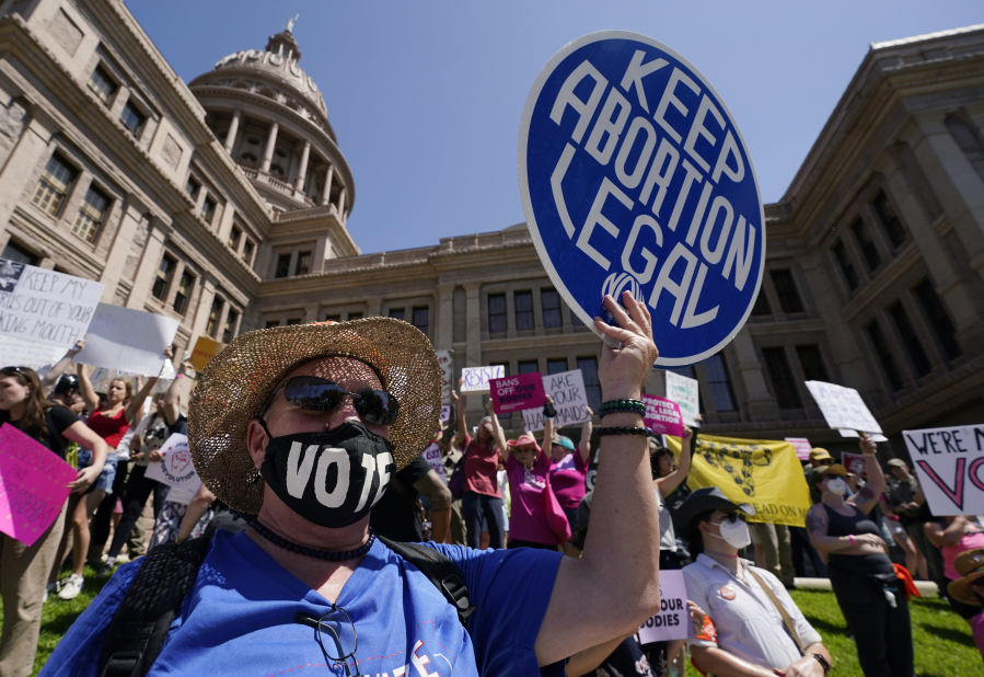 FILE - Abortion rights demonstrators attend a rally at the Texas state Capitol in Austin, Texas, May 14, 2022.  A Texas judge ruled Friday, Aug. 4, 2023,  the state's abortion ban has proven too restrictive for women with serious pregnancy complications and must allow exceptions without doctors fearing the threat of criminal charges. The challenge is believed to be the first in the U.S. brought by women who have been denied abortions since the Supreme Court last year overturned Roe v. Wade, which for nearly 50 years had affirmed the constitutional right to an abortion.