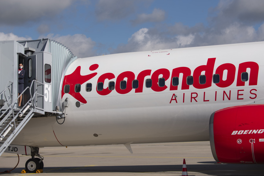 Cabin crew member Magdalini Michailidou stands on the gangway of the Corendon Airlines Europe plane at the airport Erfurt-Weimar in Erfurt, Germany, July 2, 2020.