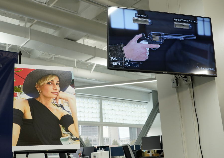 FILE - A 3D reconstruction animation video of the shooting of late cinematographer Halyna Hutchins on the set of the film "Rust" is displayed alongside a portrait of her during a news conference, Feb. 15, 2022, in Los Angeles. Film-set armorer Hannah Gutierrez-Reed will appear before a judge during a remote court hearing scheduled for Wednesday, July 19, 2023, in connection to charges related to the 2021 shooting death of a cinematographer.