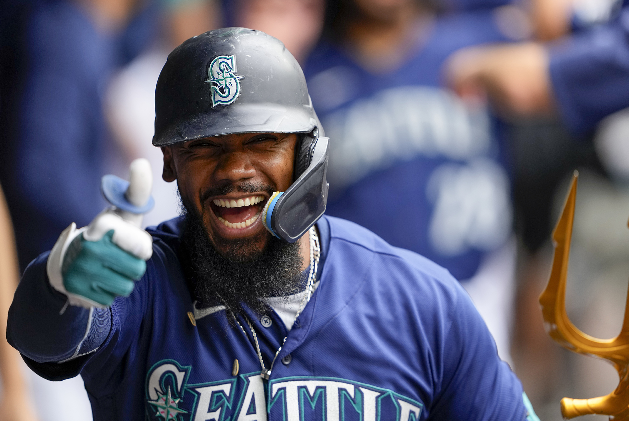 Seattle Mariners' Teoscar Hernandez gives a thumbs up as he celebrates in the dugout after hitting a three-run home run against the Oakland Athletics during the third inning of a baseball game, Wednesday, Aug. 30, 2023, in Seattle.