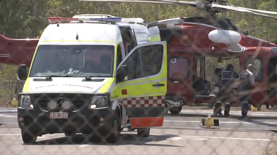 This image made from video shows a helicopter and ambulance involved in rescue mission, following an aircraft crash, in Darwin, Australia, Sunday, Aug. 27, 2023. Three United States military personnel were taken to a hospital, one with critical injuries, after a U.S. aircraft crashed on a north Australian island Sunday during a multination military exercise, officials said.