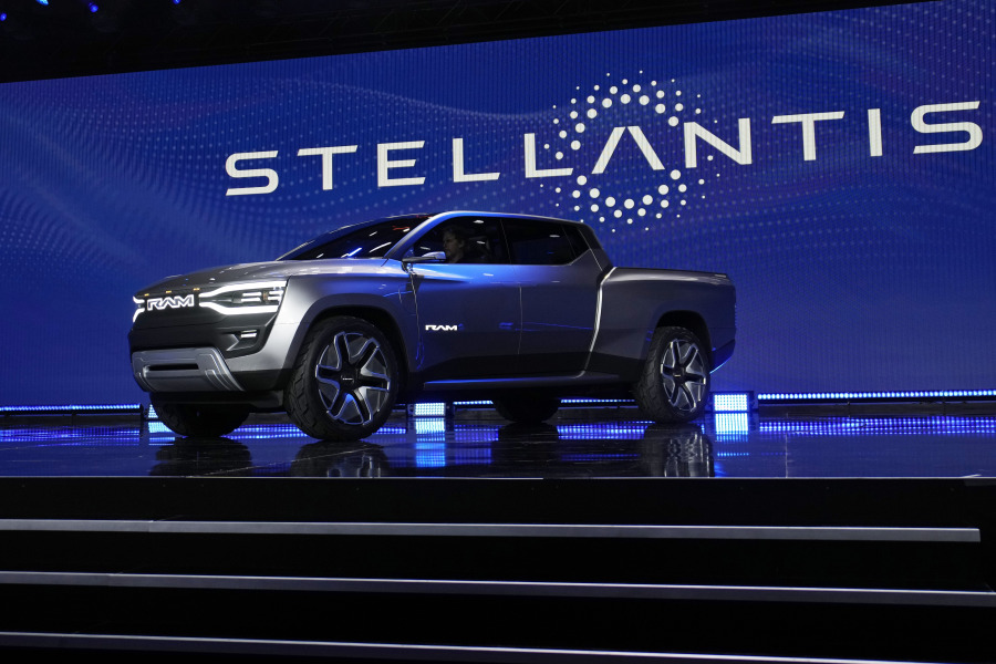 FILE - The Ram 1500 Revolution electric battery powered pickup truck is displayed on stage during the Stellantis keynote at the CES tech show on Jan. 5, 2023, in Las Vegas. Tensions rose in contract talks between the United Auto Workers union and Stellantis on Tuesday, Aug. 8, with the union president accusing the company of seeking concessions in contract talks when the union wants gains, as a September strike threat looms.