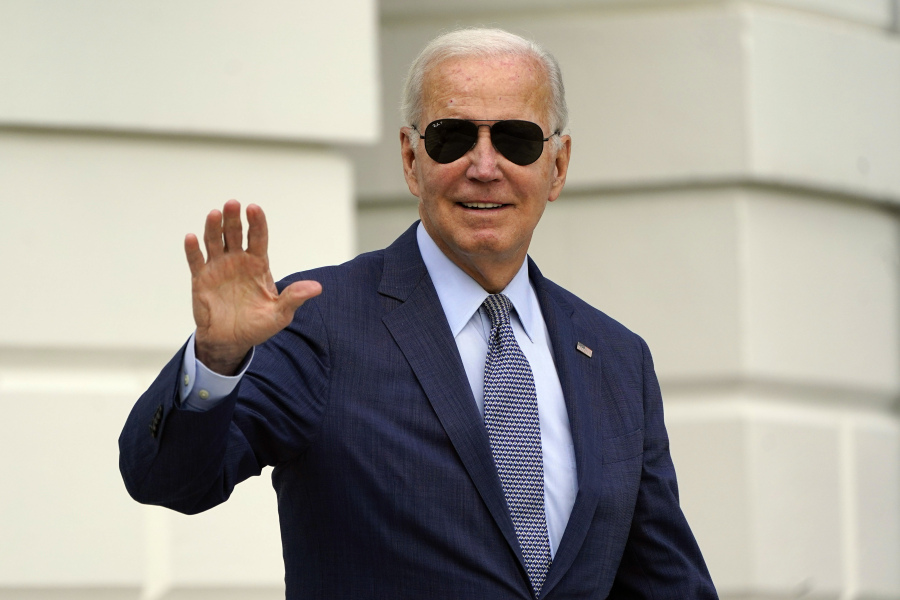 FILE - President Joe Biden waves to members of the media as he walks towards Marine One on the South Lawn of the White House in Washington, Aug. 11, 2023. Biden is stopping in the battleground state of Wisconsin to discuss how economic policies he calls "Bidenomics" are boosting the economy. It's a trip on Tuesday timed one day before the first anniversary of the Inflation Reduction Act, a major economic bill Biden signed into law.