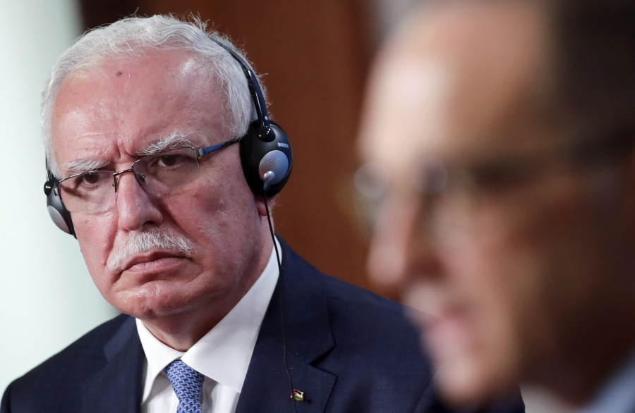 CORRECTS NAME OF PALESTINE FOREIGN MINISTER, FILE - Palestine Foreign Minister Riad Malki, left, listens to German Foreign Minister Heiko Maas, right, during a news conference following their meeting, in Berlin, Germany, on Nov. 17, 2020.  Demonstrating heightened tensions with the United States, the Palestinian foreign minister on Thursday, Aug.